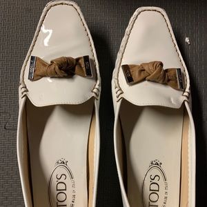 Brand new Tod's patent leather loafers with bow